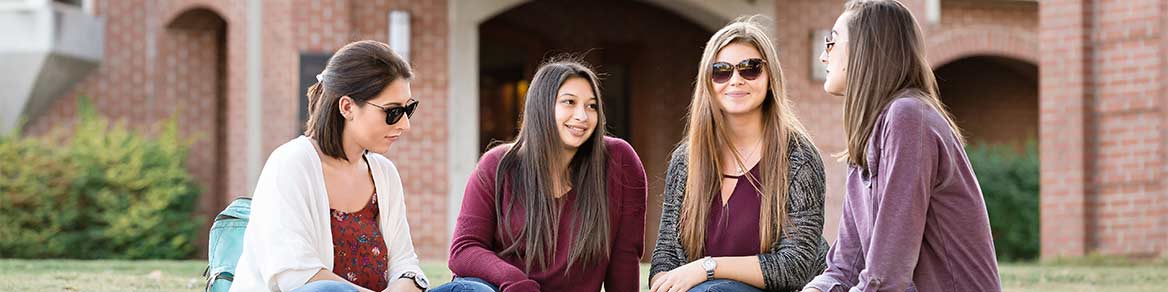 Students seated on campus