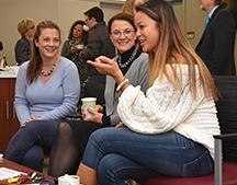 Faculty and students chat